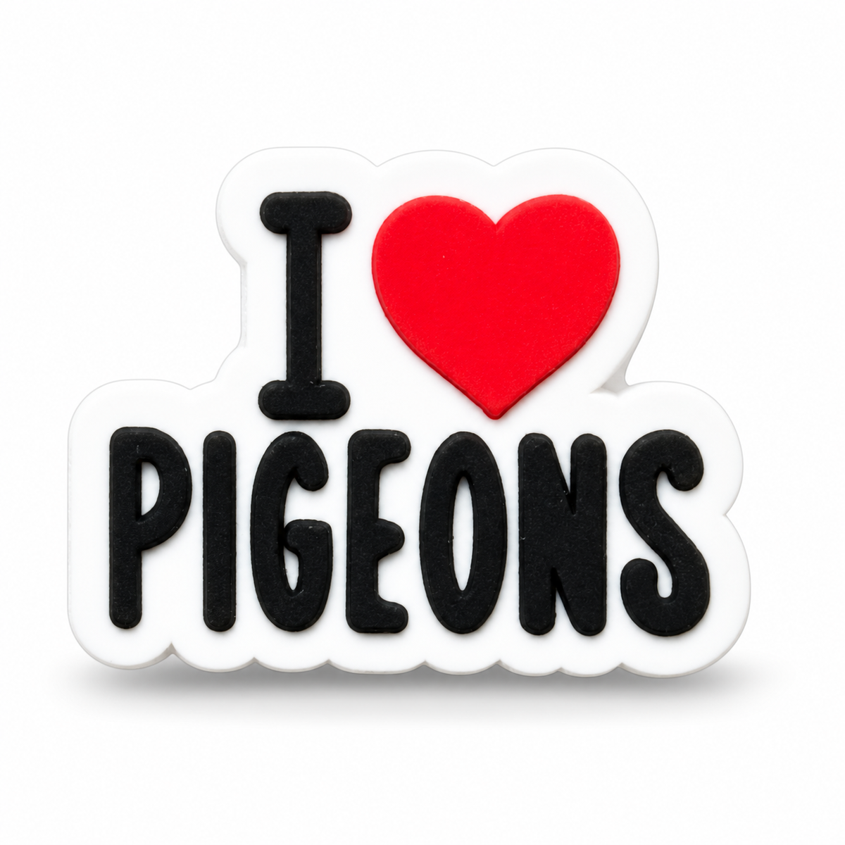 A charm with the text 'I' in black, a red heart, and 'PIGEONS' in black, outlined in white, shown on a plain white background.