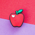 Red Apple croc like shoe charm with white heart accent. 