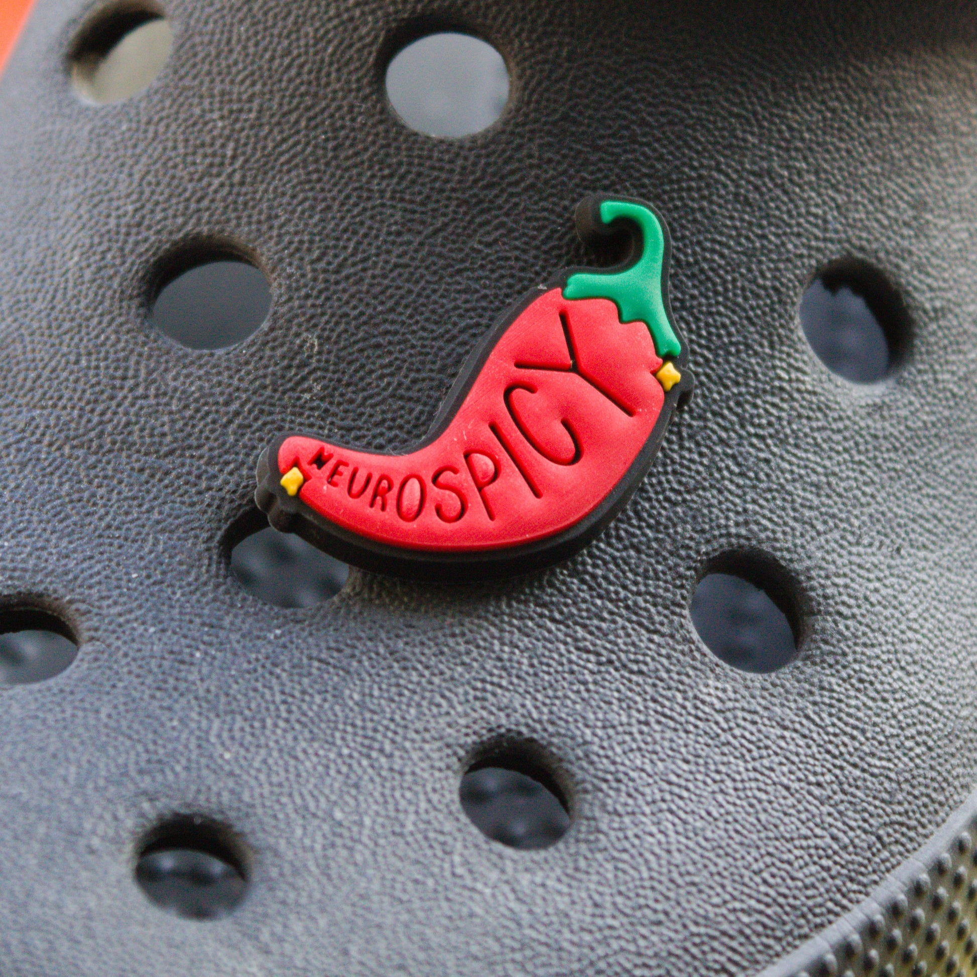 Neurospicy Chilli Pepper croc like shoe charm. Modelled on a black croc shoe. 