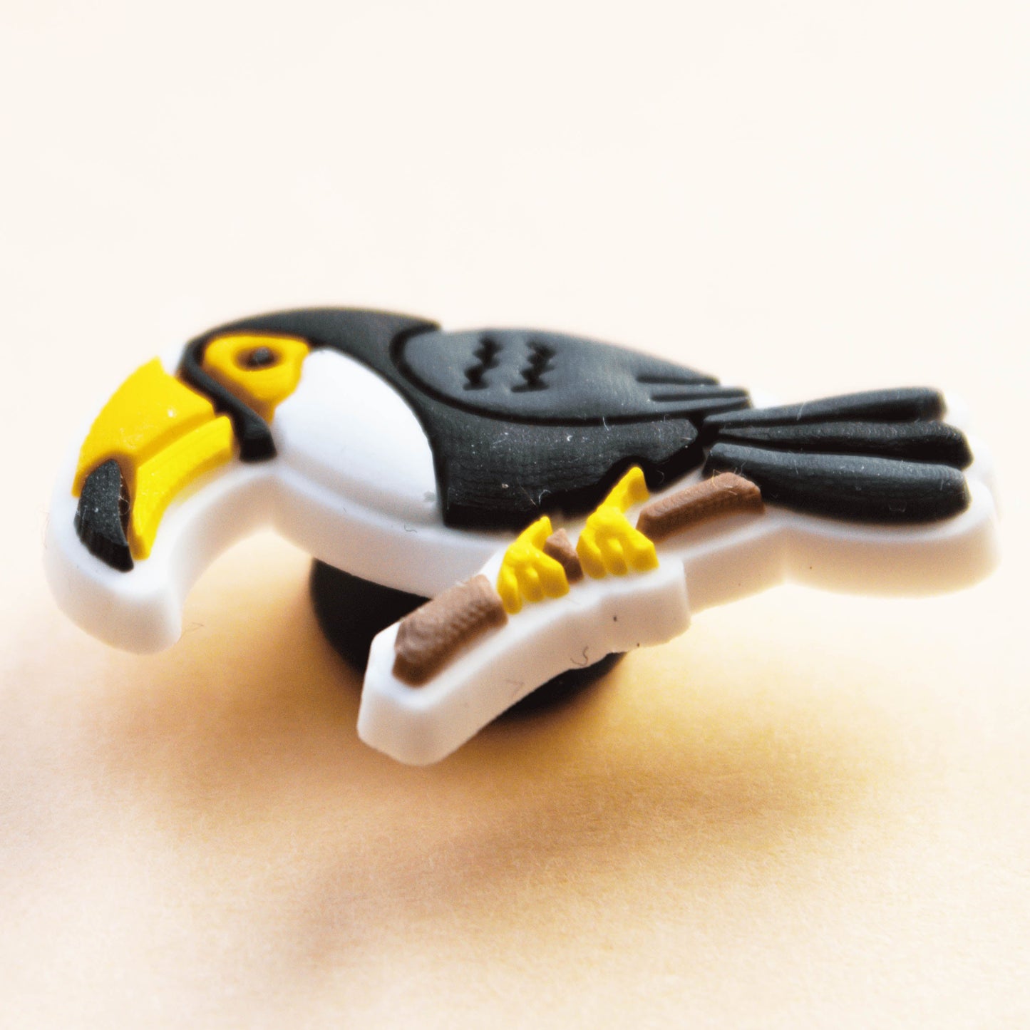 Toucan Bird croc like shoe charm. Close up.