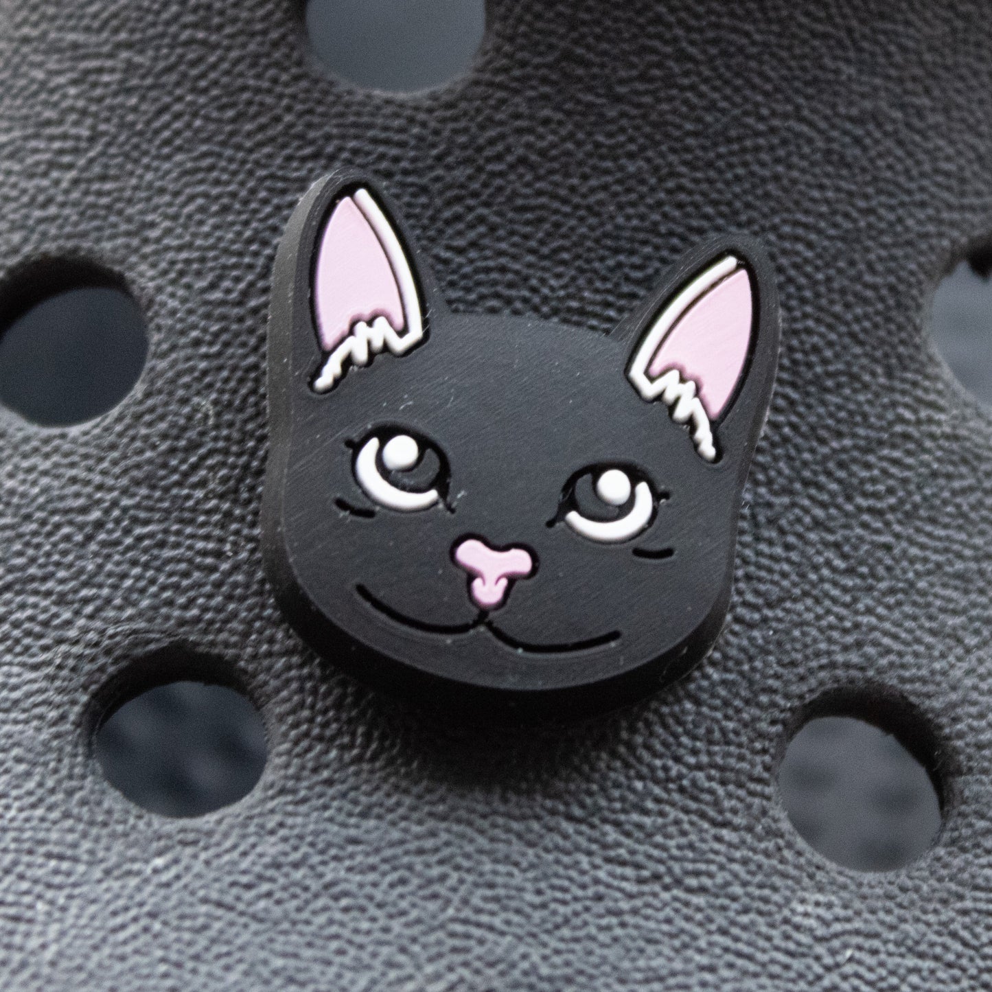 Black Cat Face croc like shoe charm. Shown on a black croc shoe. 