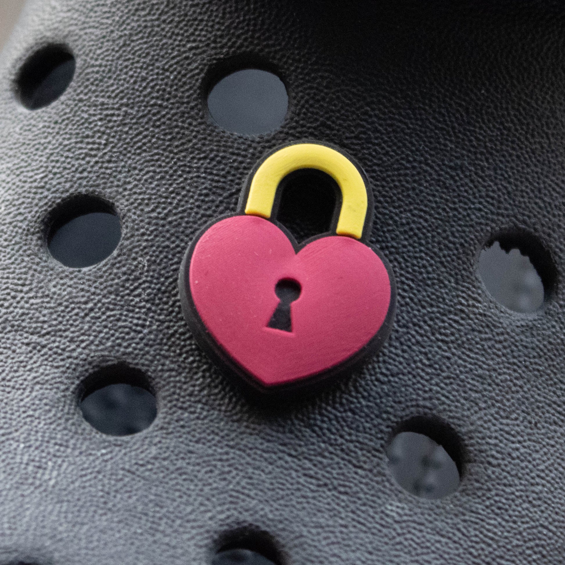 Heart Padlock croc like shoe charm. Pinky red and yellow. Modelled on a black croc shoe. 