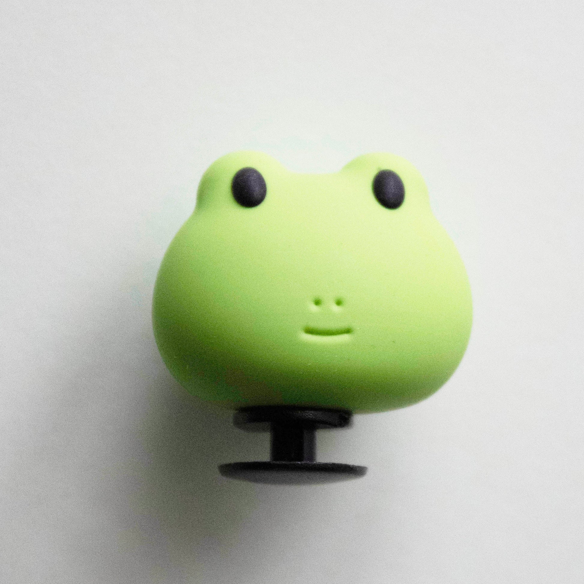 3D Frog Face croc like shoe charm. Close up image. 