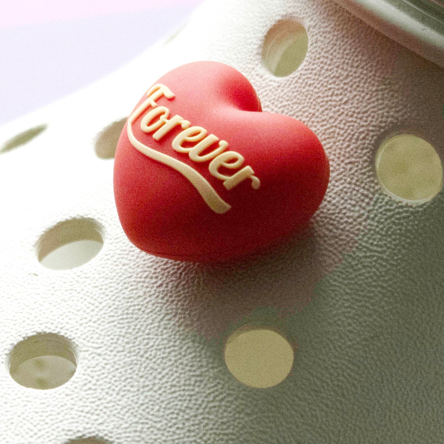 Forever heart premium croc like shoe charm. Red heart, lemon writing. Modelled on a cream croc shoe. 