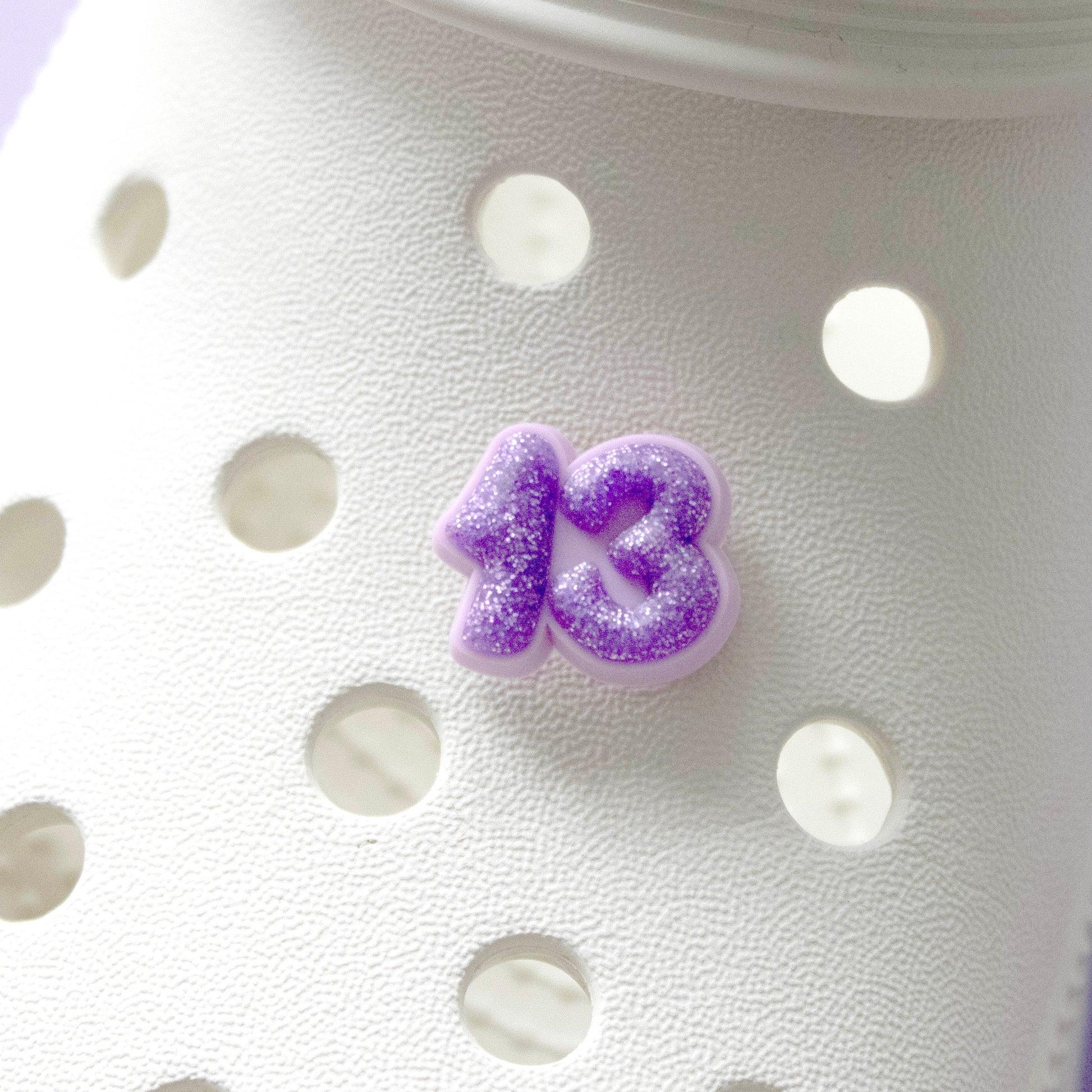 Purple glitter number 13 croc like shoe charm. Premium quality. Modelled on a cream croc shoe. 