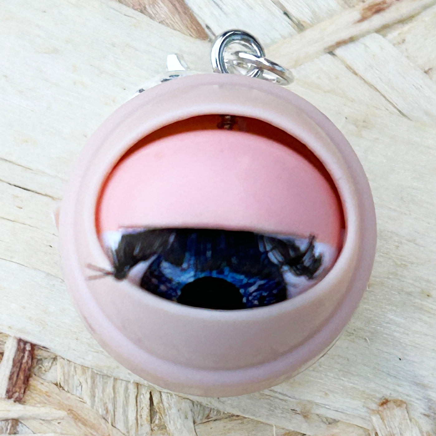 Dolls eye stick marker on a wooden background