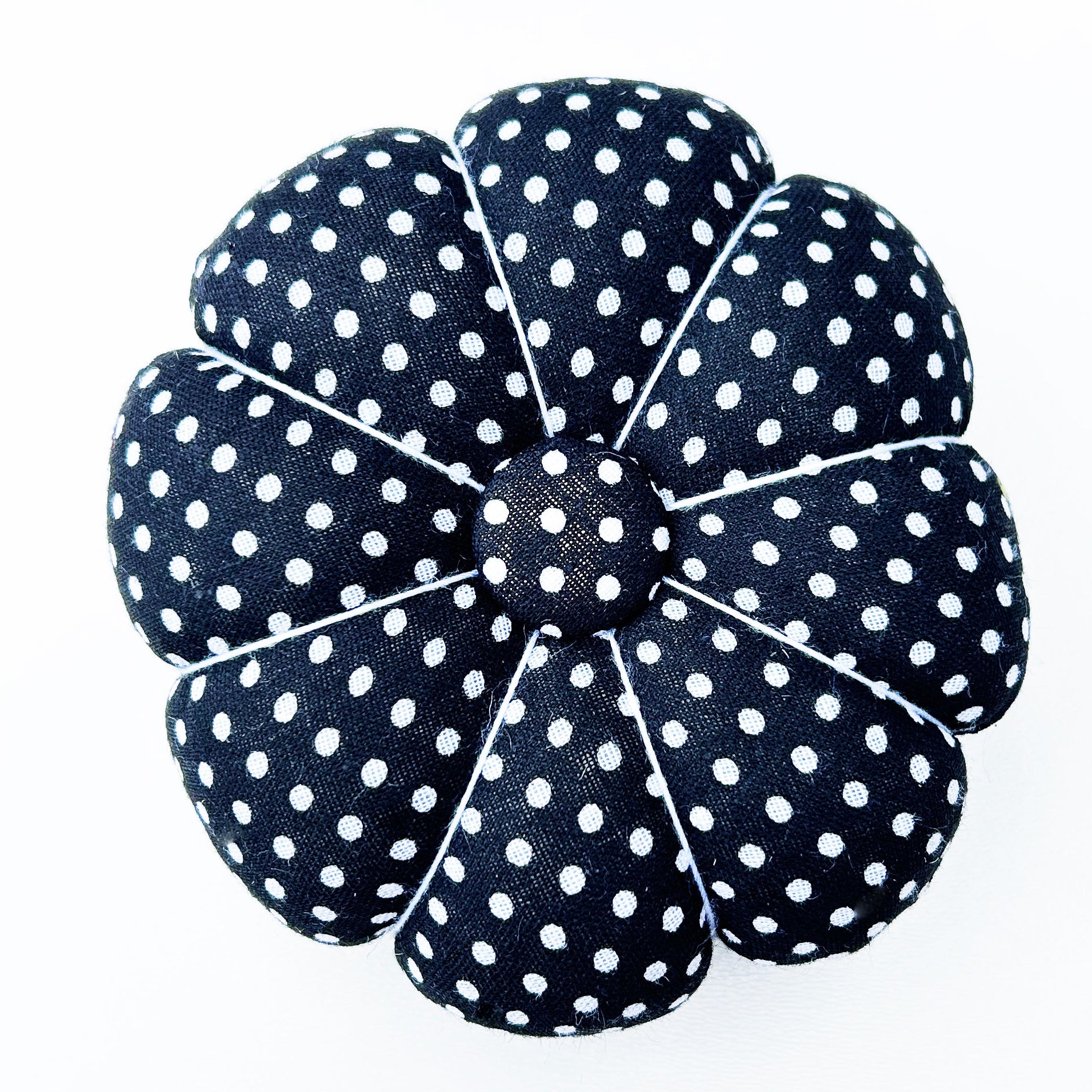 Black and white spotty wrist pin cushion