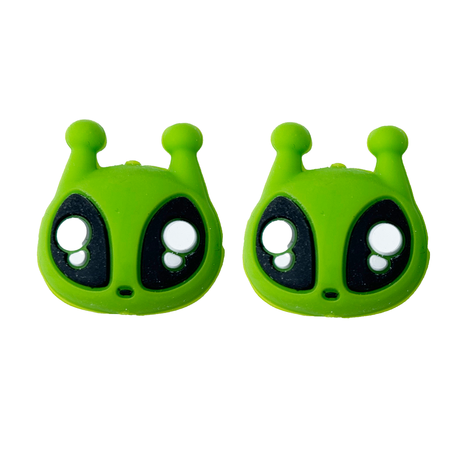 Two green alien needle point protectors on a white background