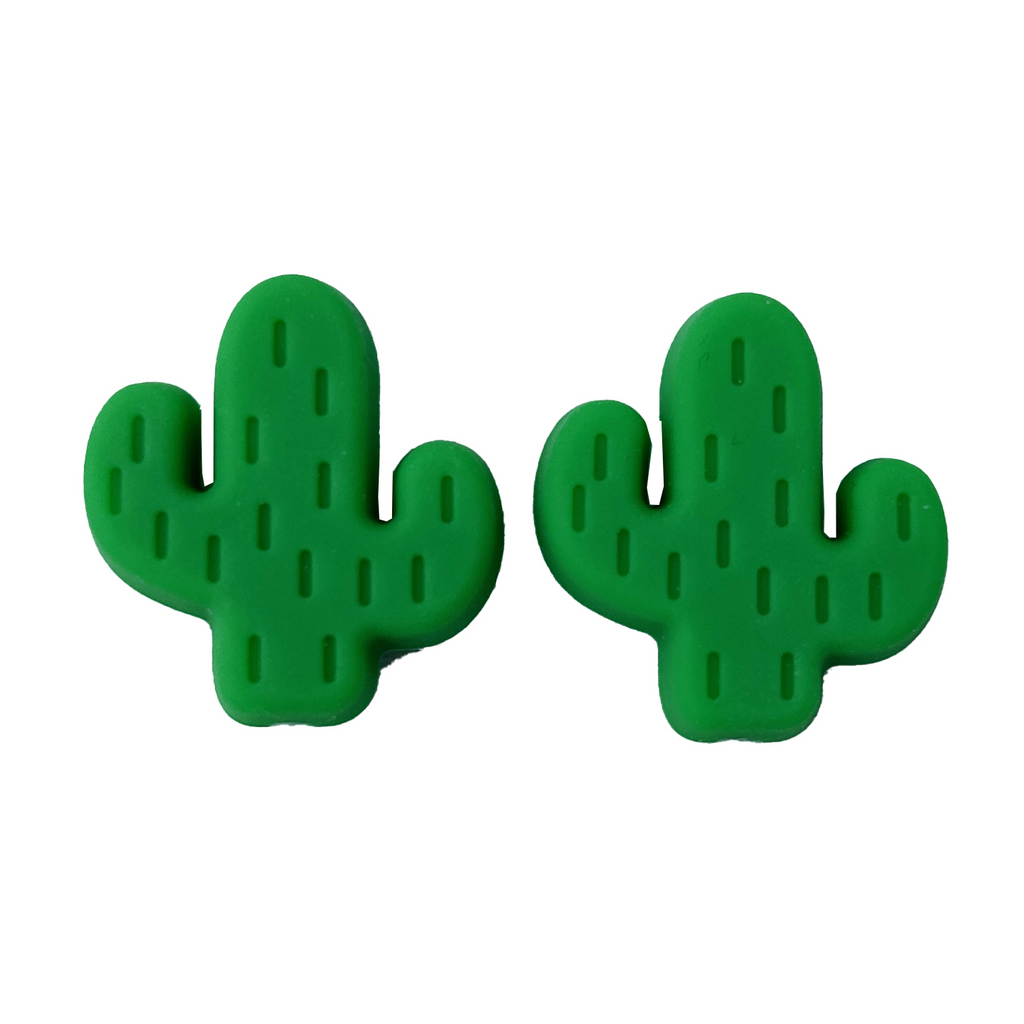 Green cactus-shaped needle point protectors on a white background