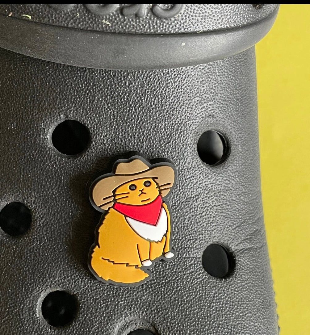 Cowboy cat shoe charm on a croc shoe.