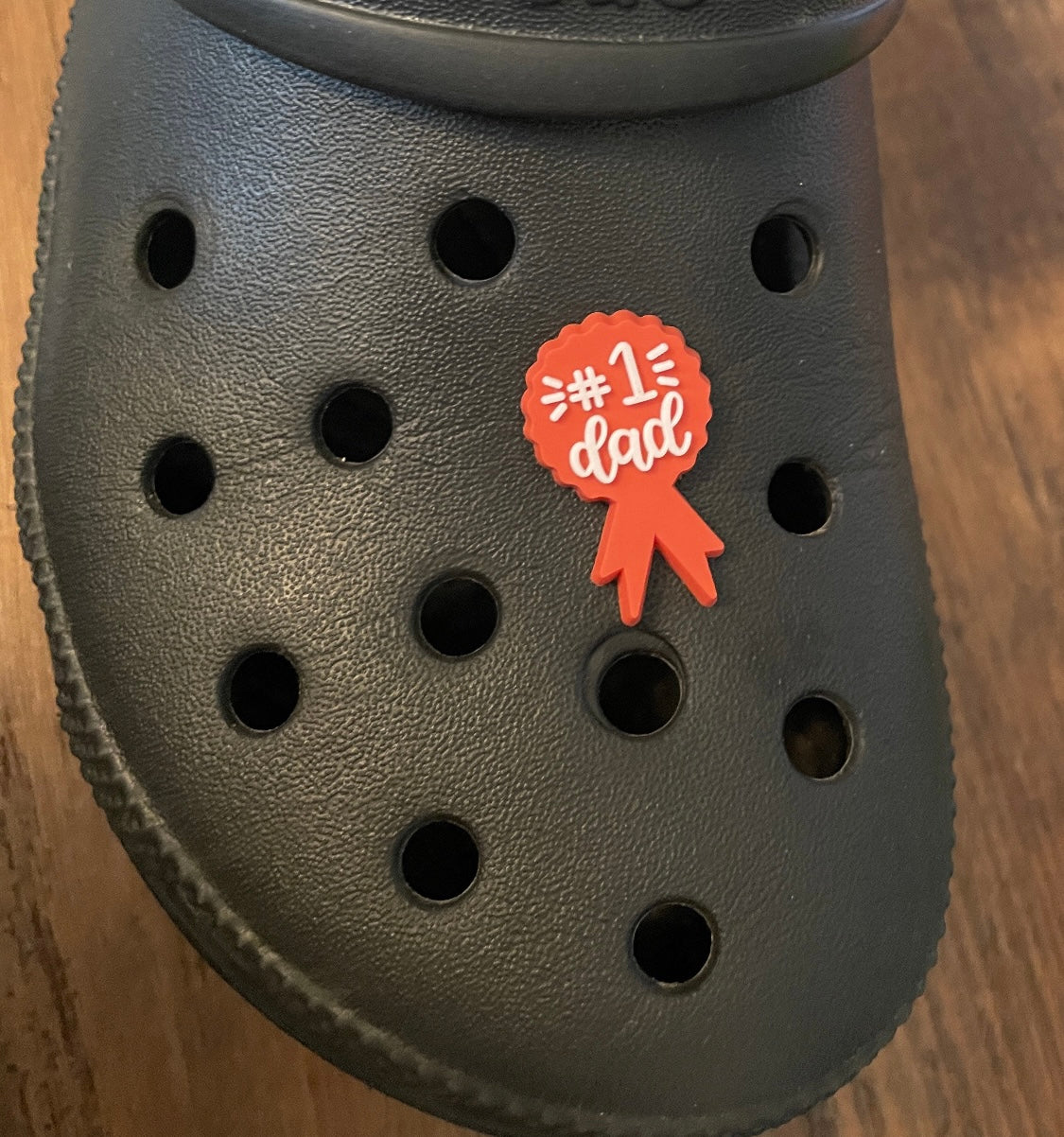 Number 1 Dad Shoe Charm on a croc shoe.