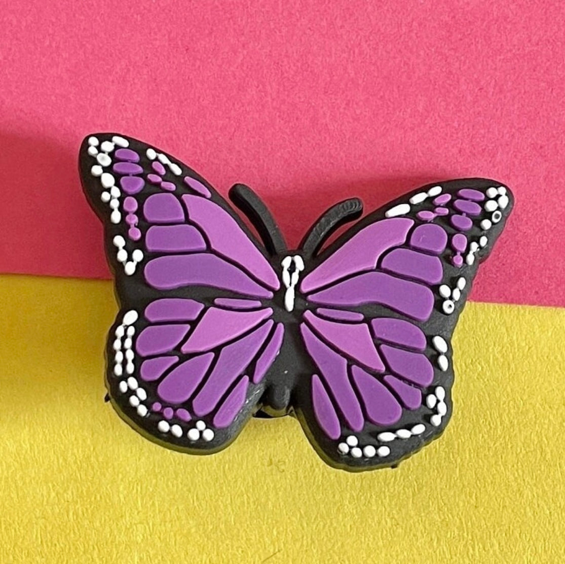 Purple butterfly shoe charm. Wings outstretched.