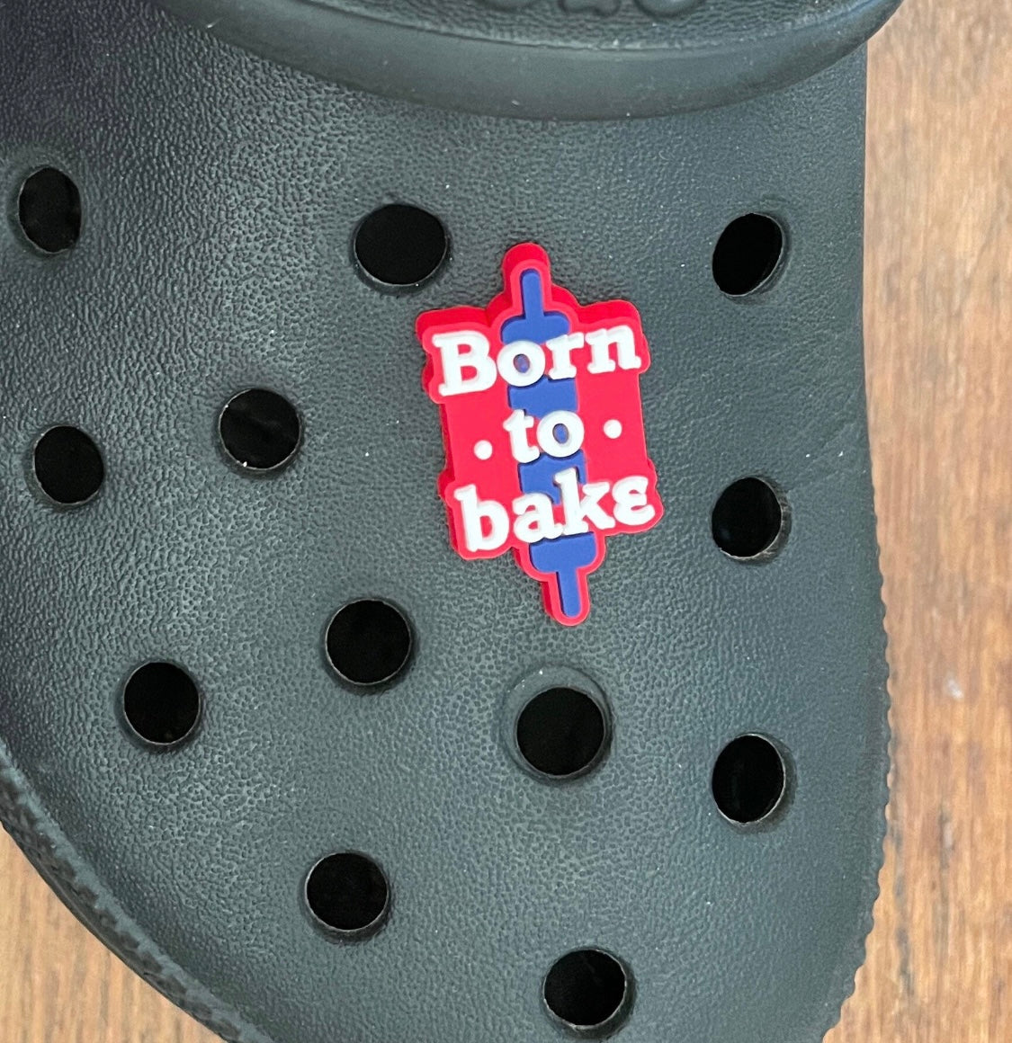 Born to bake shoe charm on a croc shoe. 
