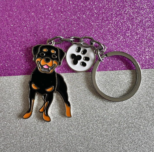 Rottweiler enamel keyring with paw charm.