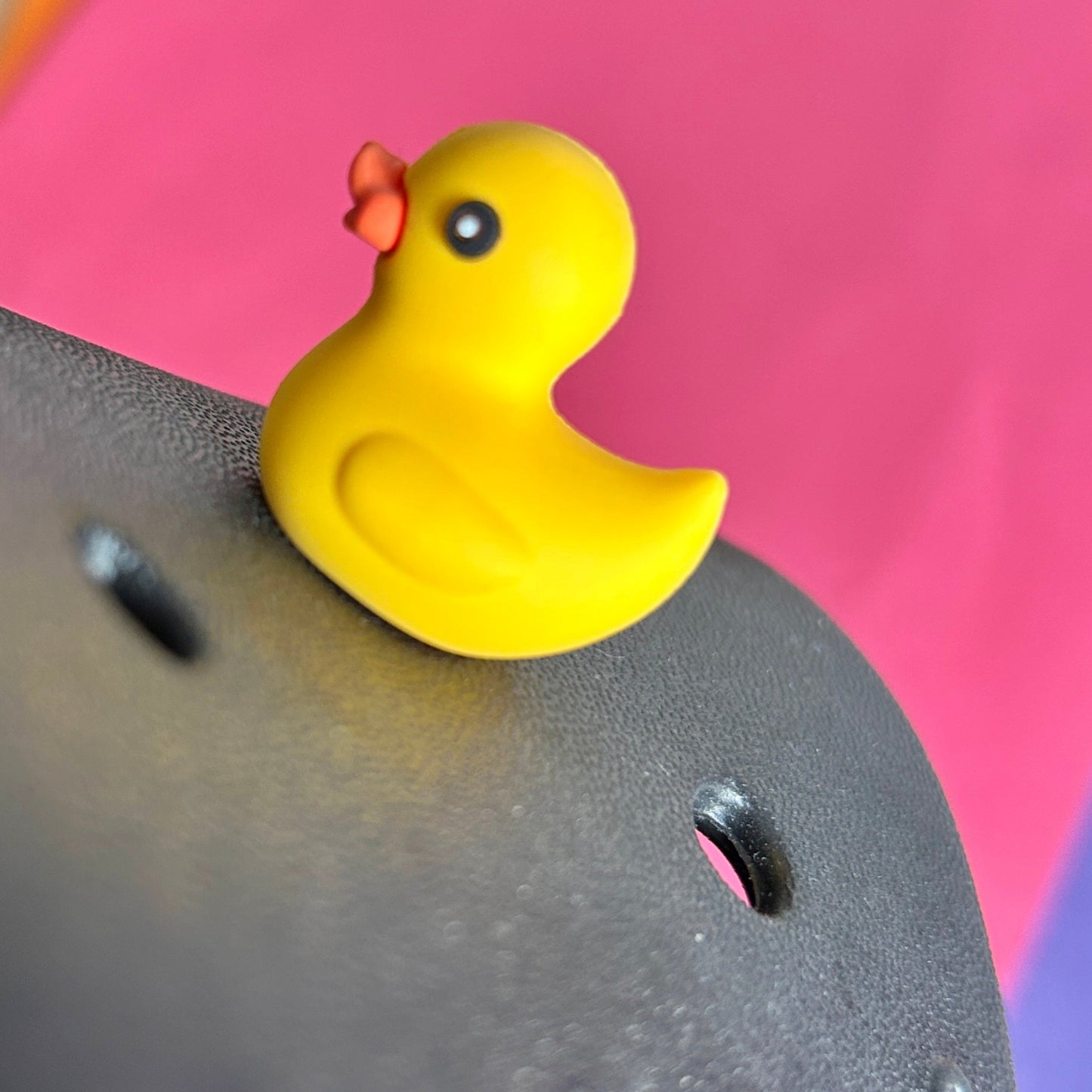 3D Rubber Duck croc like shoe charm. Shown on a black croc shoe. 