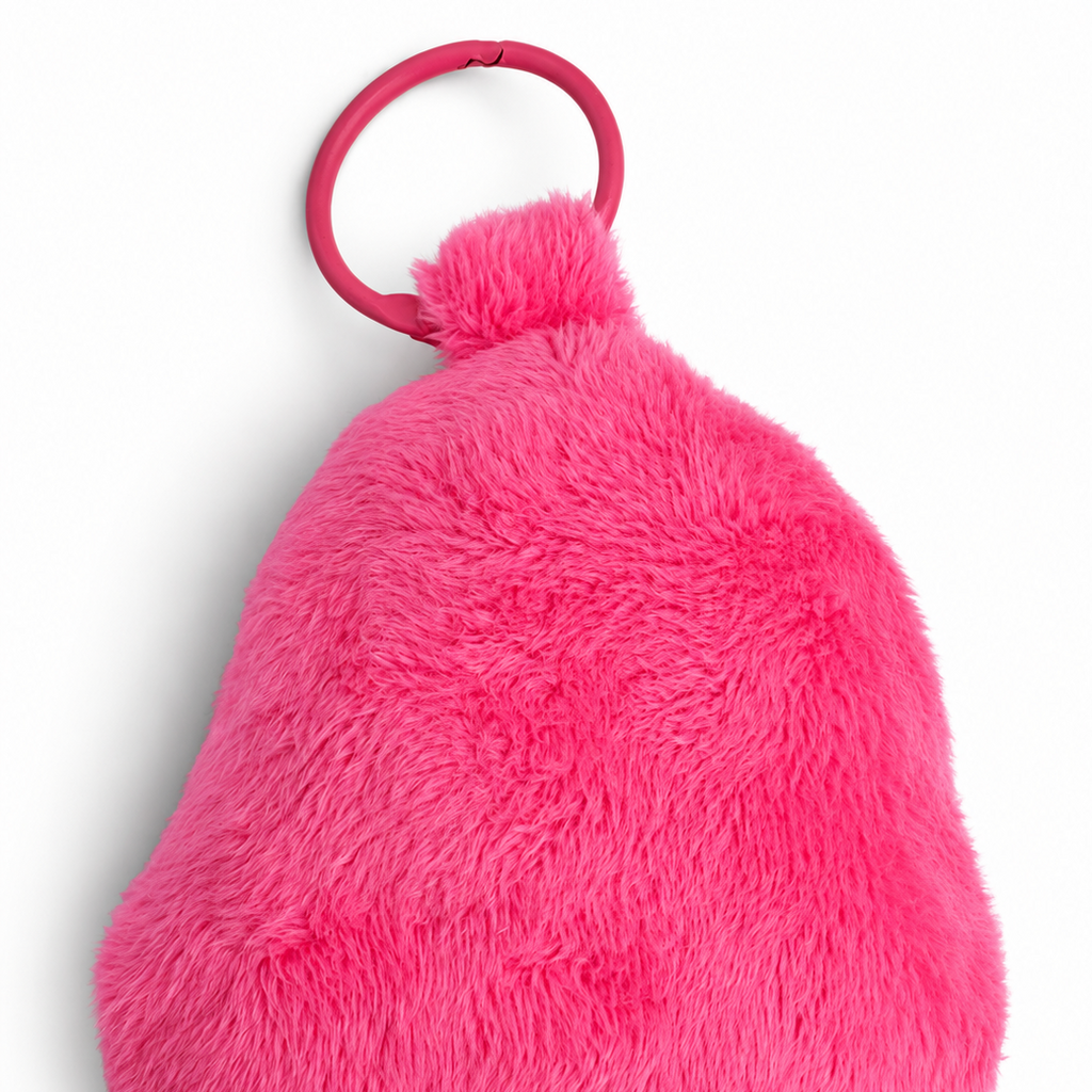 A bright pink fuzzy back view with a matching pink plastic ring attachment, photographed on a clean white background.