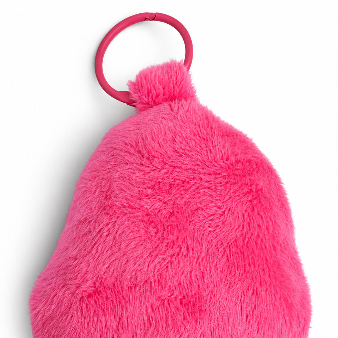 A bright pink fuzzy back view with a matching pink plastic ring attachment, photographed on a clean white background.