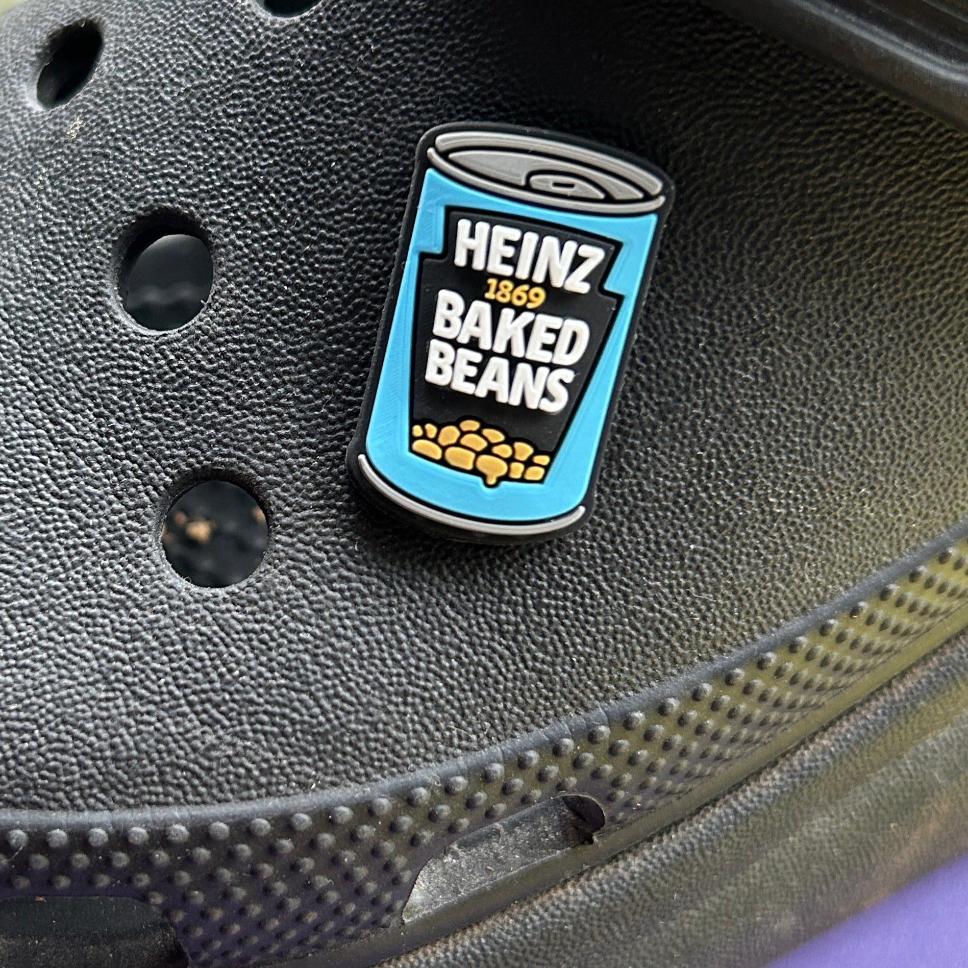 Can of Baked Beans croc like shoe charm. Shown on a black croc shoe.