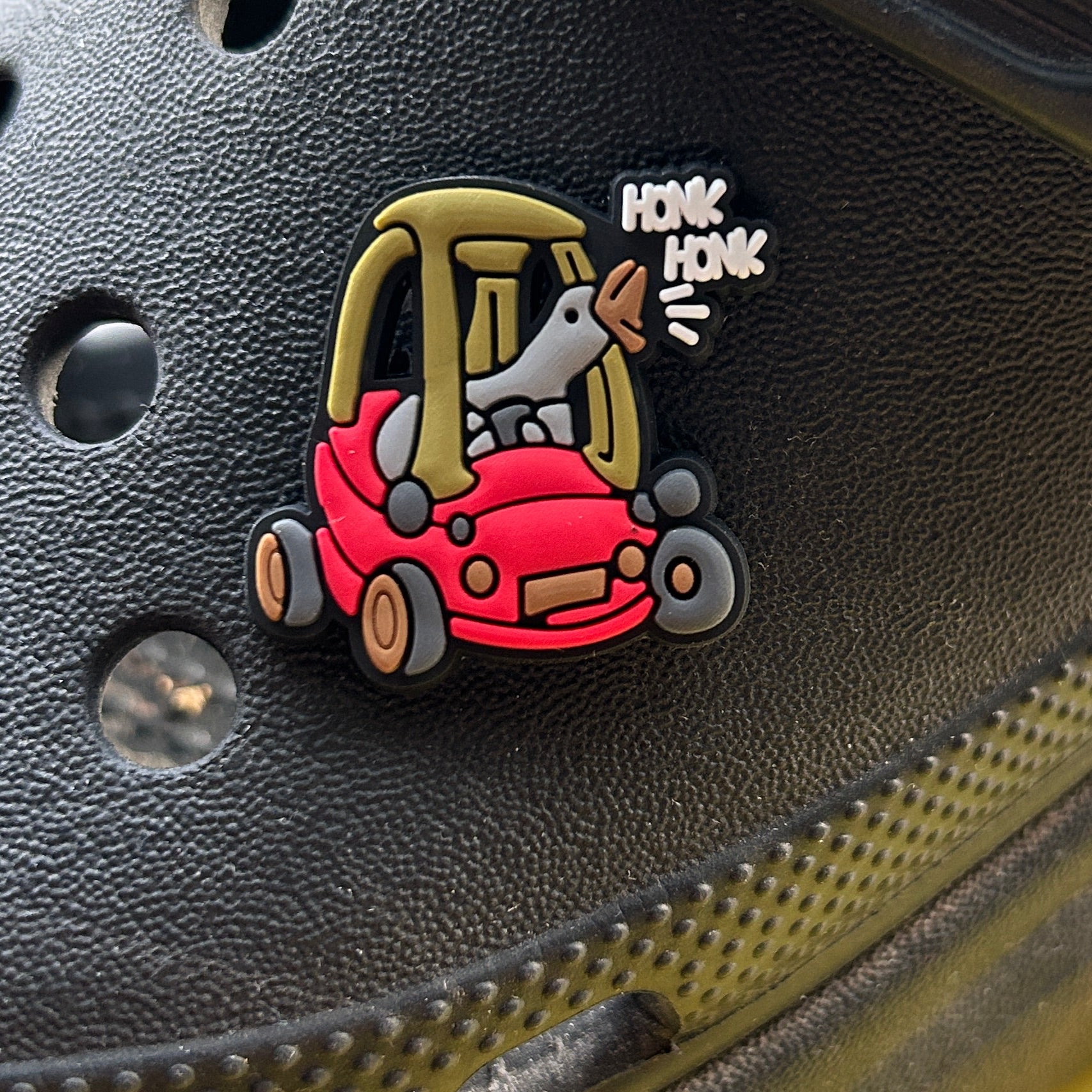 Honk Honk Goose in a Toy Car croc like shoe charm. Shown on a black croc shoe.