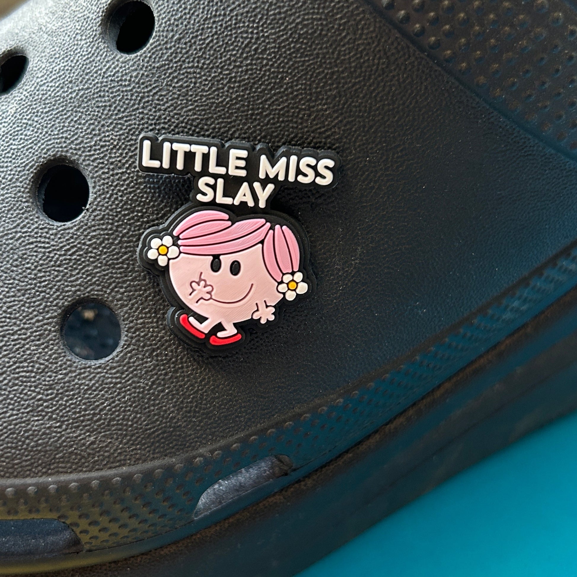 Little Miss Slay slogan croc like shoe charm. Shown on a black croc shoe. 