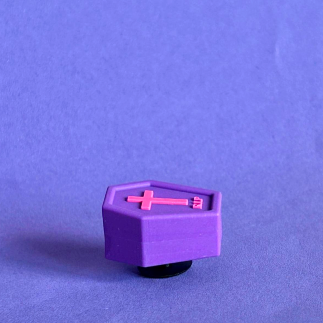 Purple 3D coffin shoe charm for crocs. Side view.