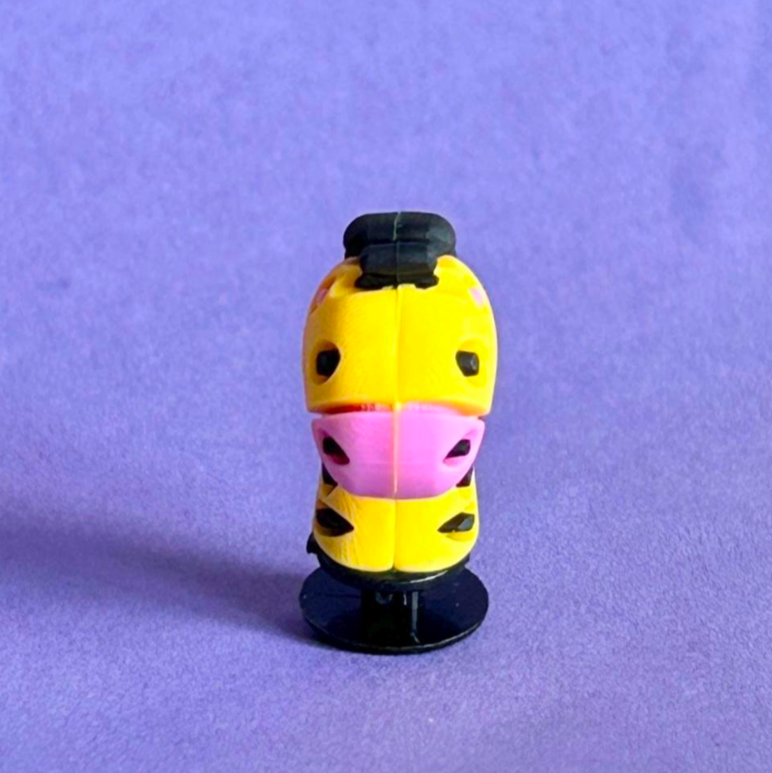 Yellow and Black 3D Giraffe croc like shoe charm. Front view. 