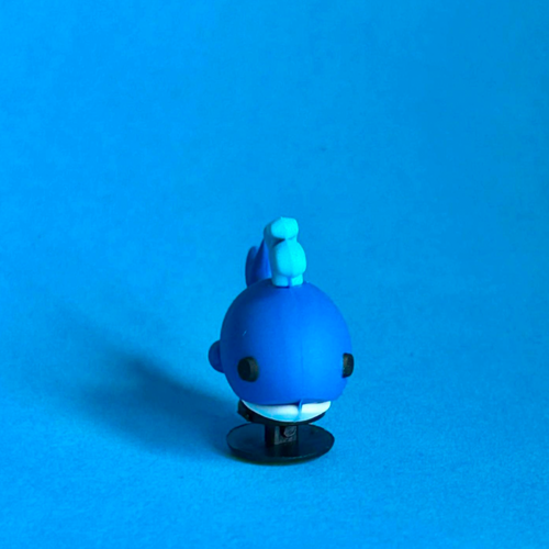 3D Whale croc like shoe charm squirting water. Front view.