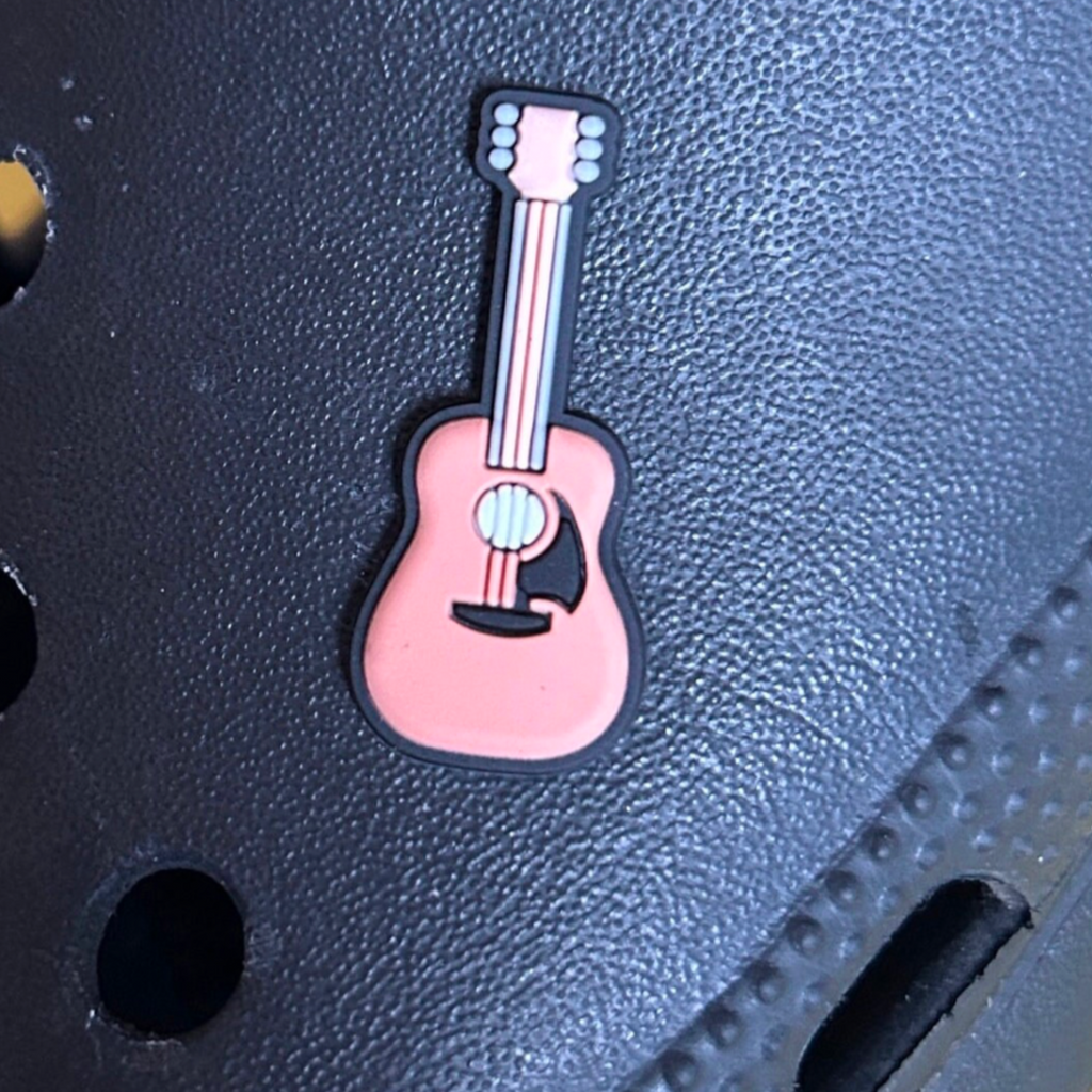 Acoustic Guitar croc like shoe charm. Shown on a black croc shoe. 