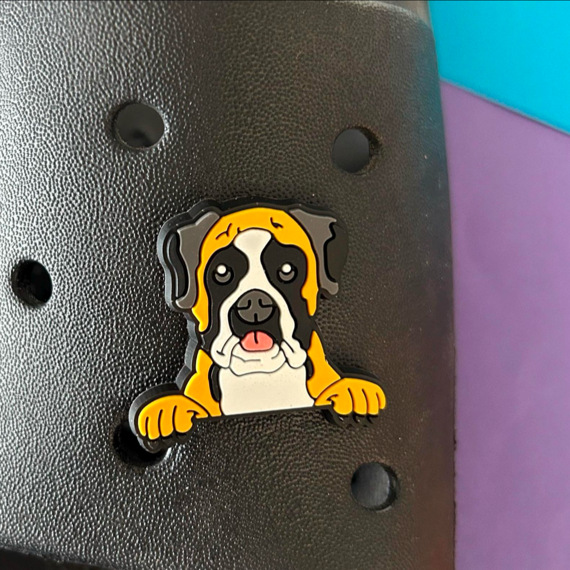 Boxer Dog Face croc like shoe charm. Shown on a black croc show. 