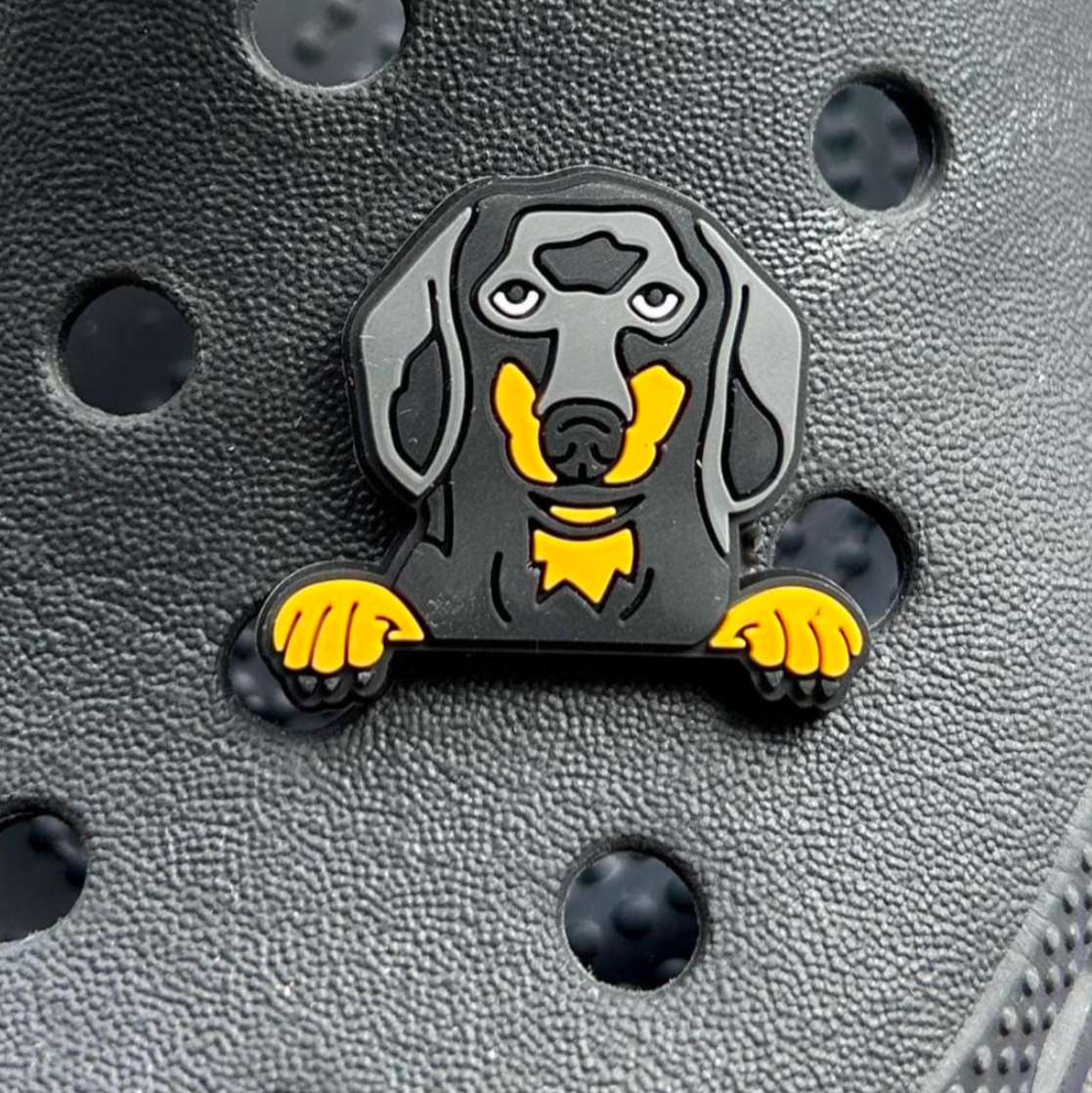 Black and Tan Dachshund Dog Face croc like shoe charm. Shown on a black croc shoe. 