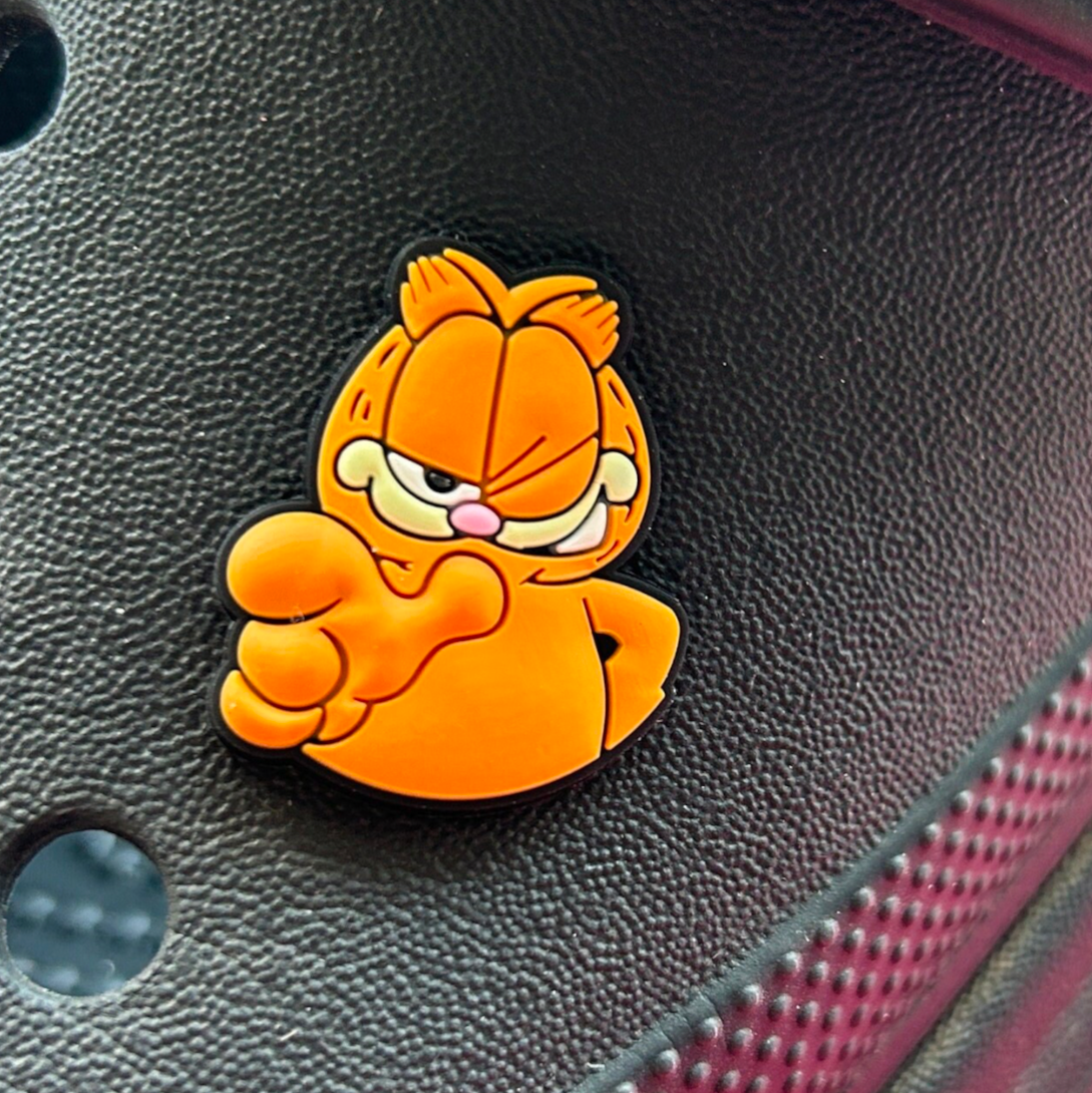 Winking Ginger Cat croc like shoe charm. Shown on a black croc shoe. 