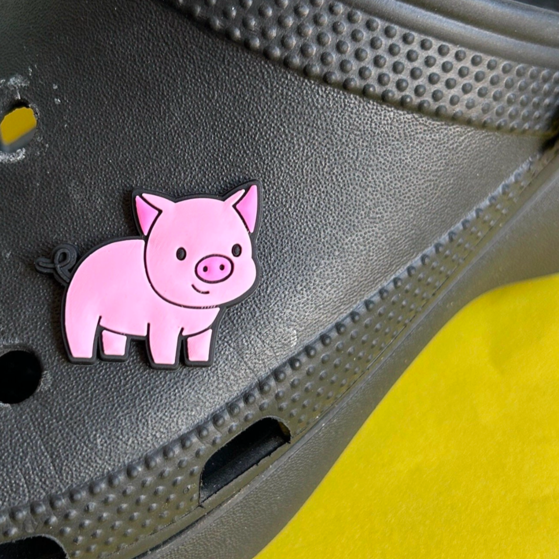 Cute Pig croc like shoe charm. Shown on a black croc shoe. 