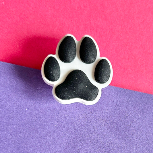 Black and white dog Paw Print croc like shoe charm.