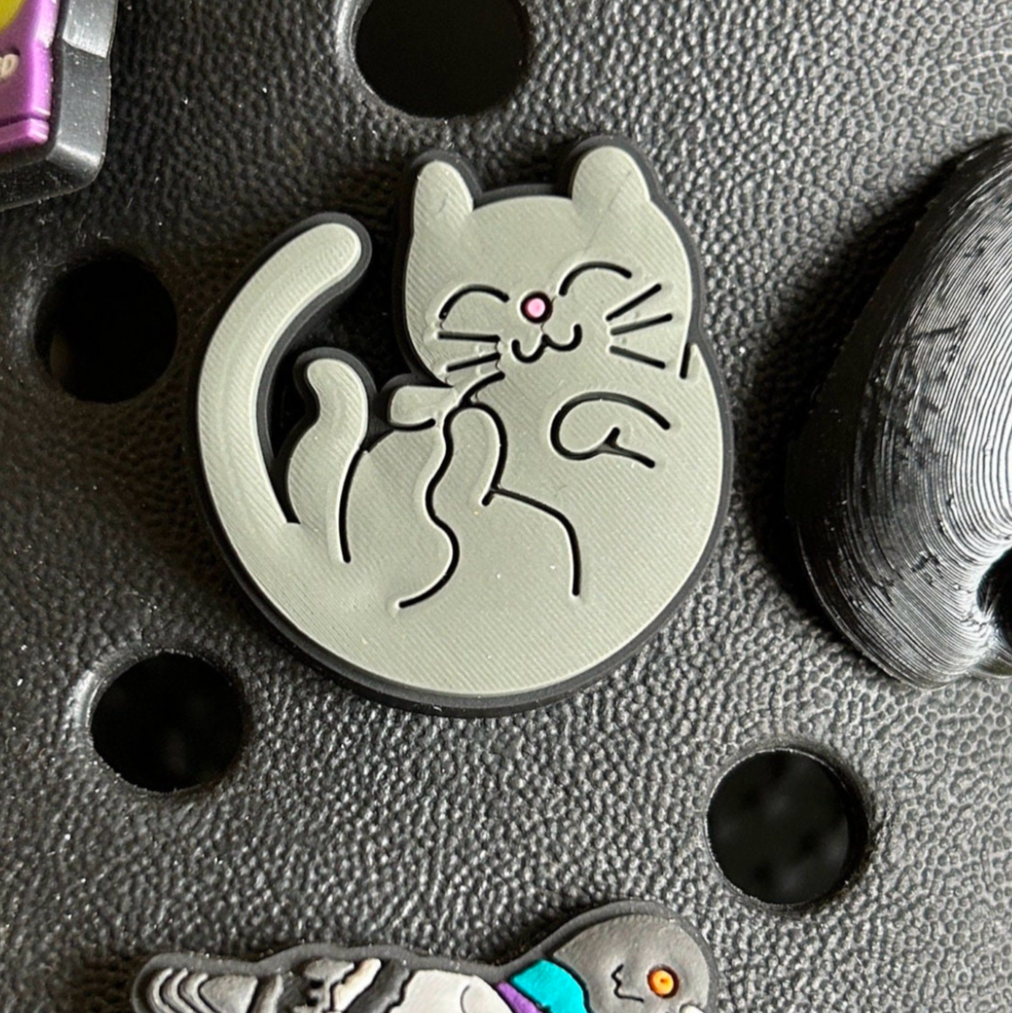 Cute Grey Cat croc like shoe charm. Shown on a black croc shoe. 