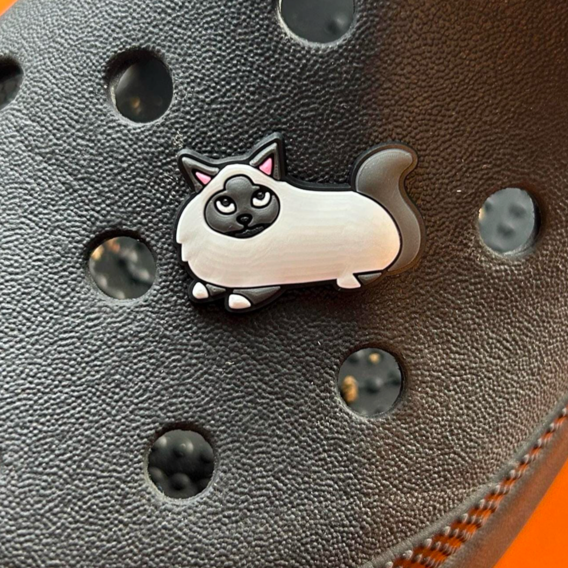 Blue Point Cat croc like shoe charm. Shown on a black croc shoe. 