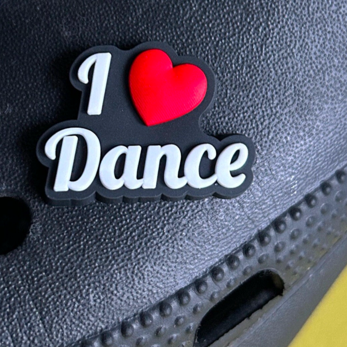 I Love Dance croc like shoe charm. Shown on a black croc shoe. 