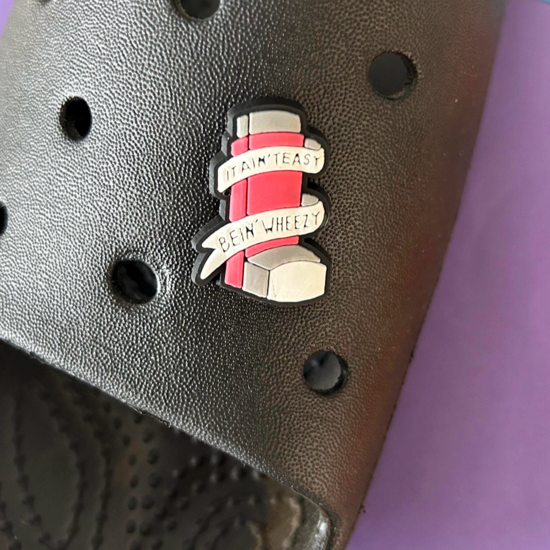 It aint easy being wheezy - Inhaler croc like shoe charm. Shown on a black croc shoe. 