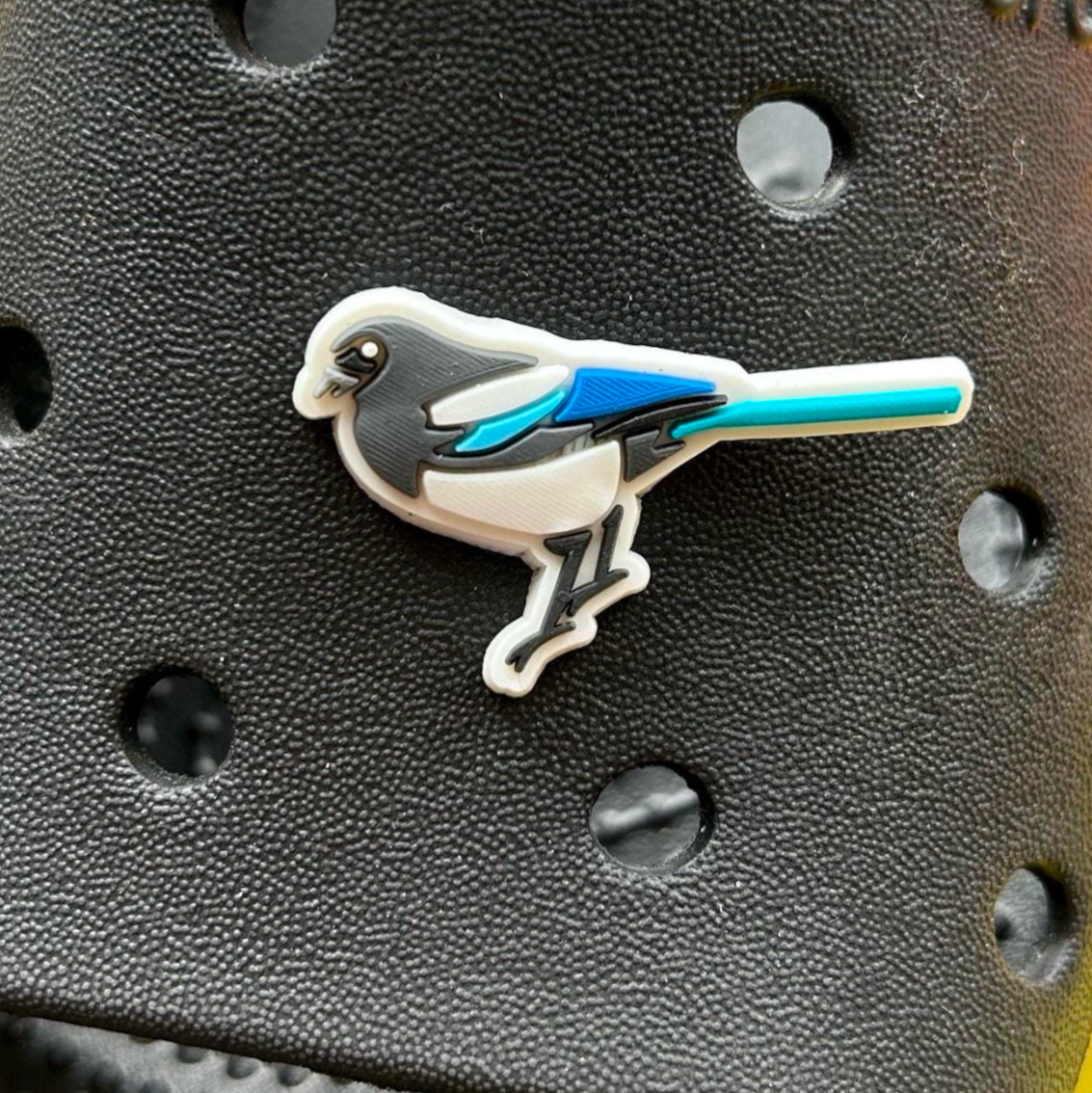 Magpie Bird croc like shoe charm. Shown on a black croc shoe. 