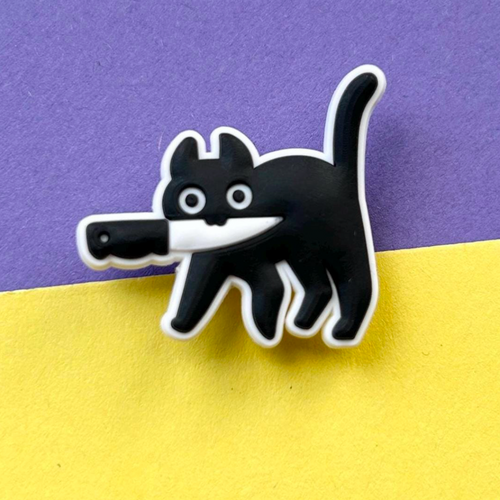 Black and white murder cat croc like shoe charm.