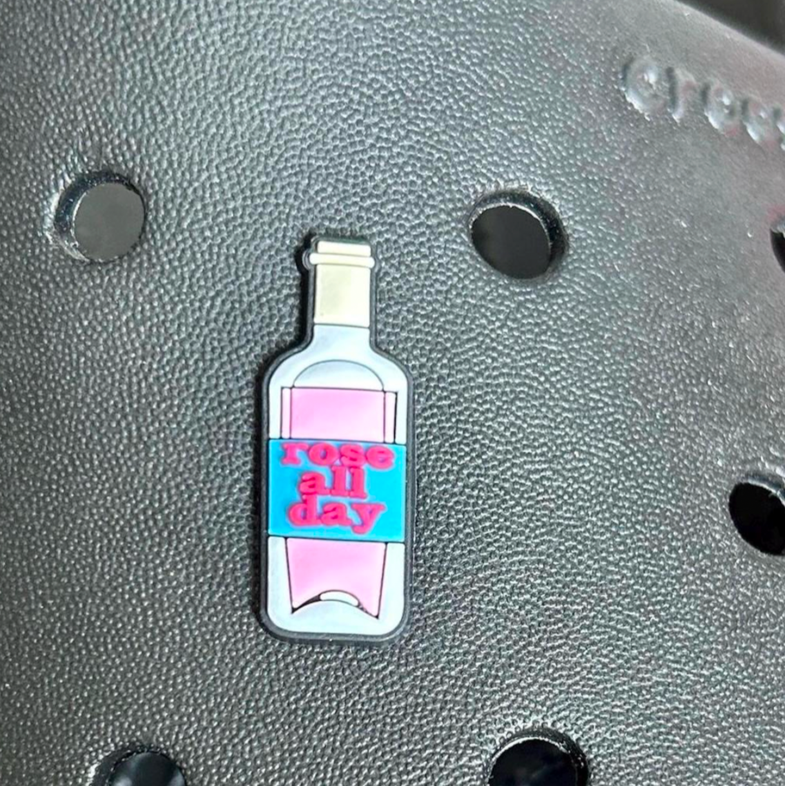 Rose All Day Wine Bottle croc like shoe charm. Shown on a black croc shoe. 