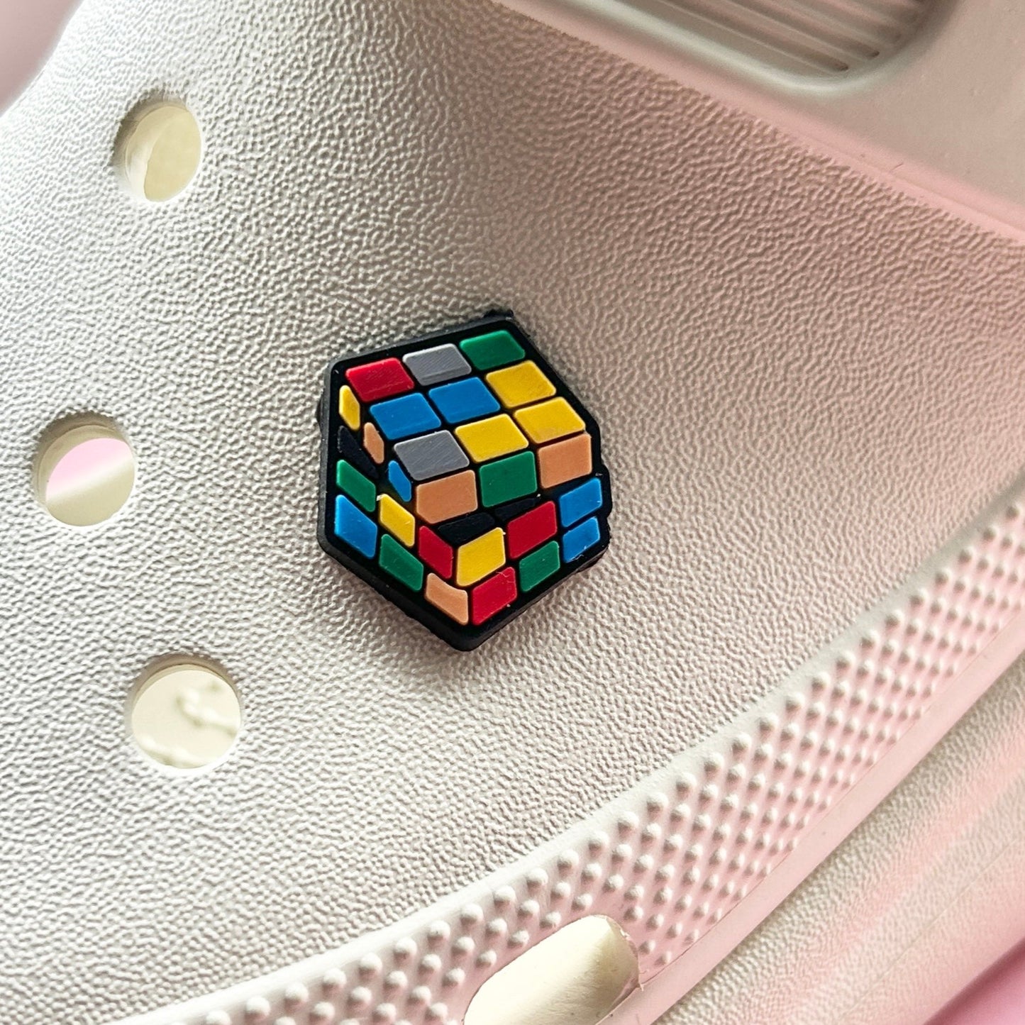 Retro Puzzle Cube croc like shoe charm. Shown on a cream croc shoe. 