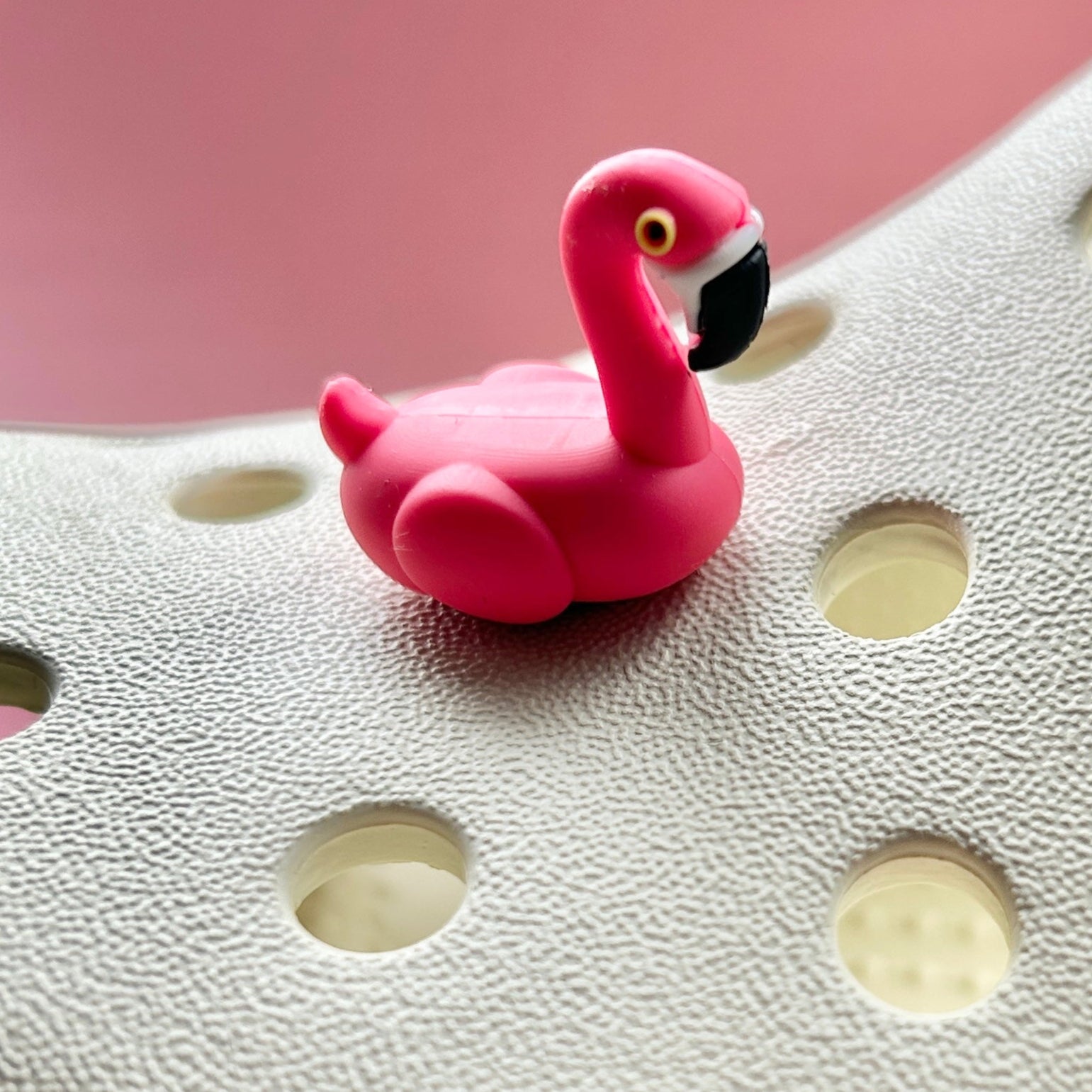 3D Flamingo bird croc like shoe charm. Shown on a cream croc shoe. 