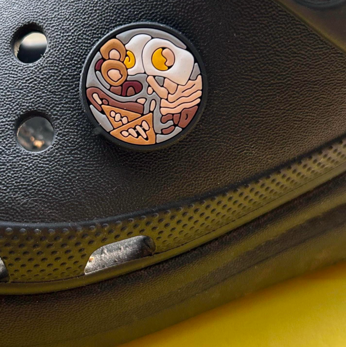 English Fry Up croc like shoe charm. Shown on a black croc shoe. 