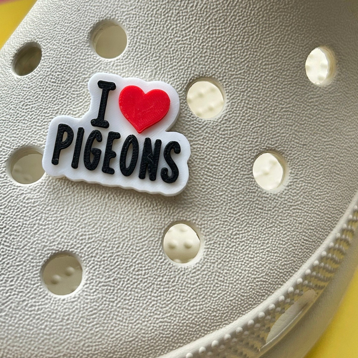 Handmade 3D Printed I Love Pigeons croc like shoe charm. Shown on a cream croc shoe. 