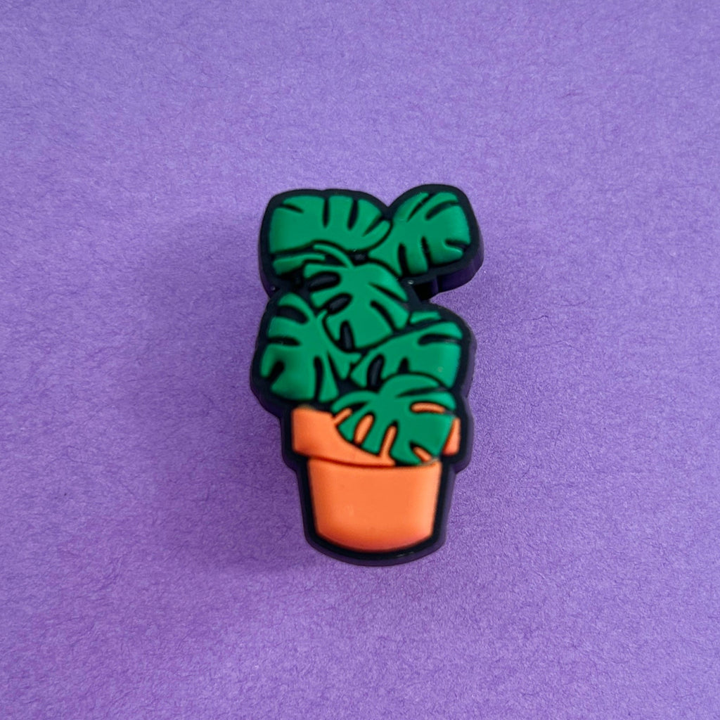 Monstera plant Croc shoe charm. Green plant in an orange pot. 