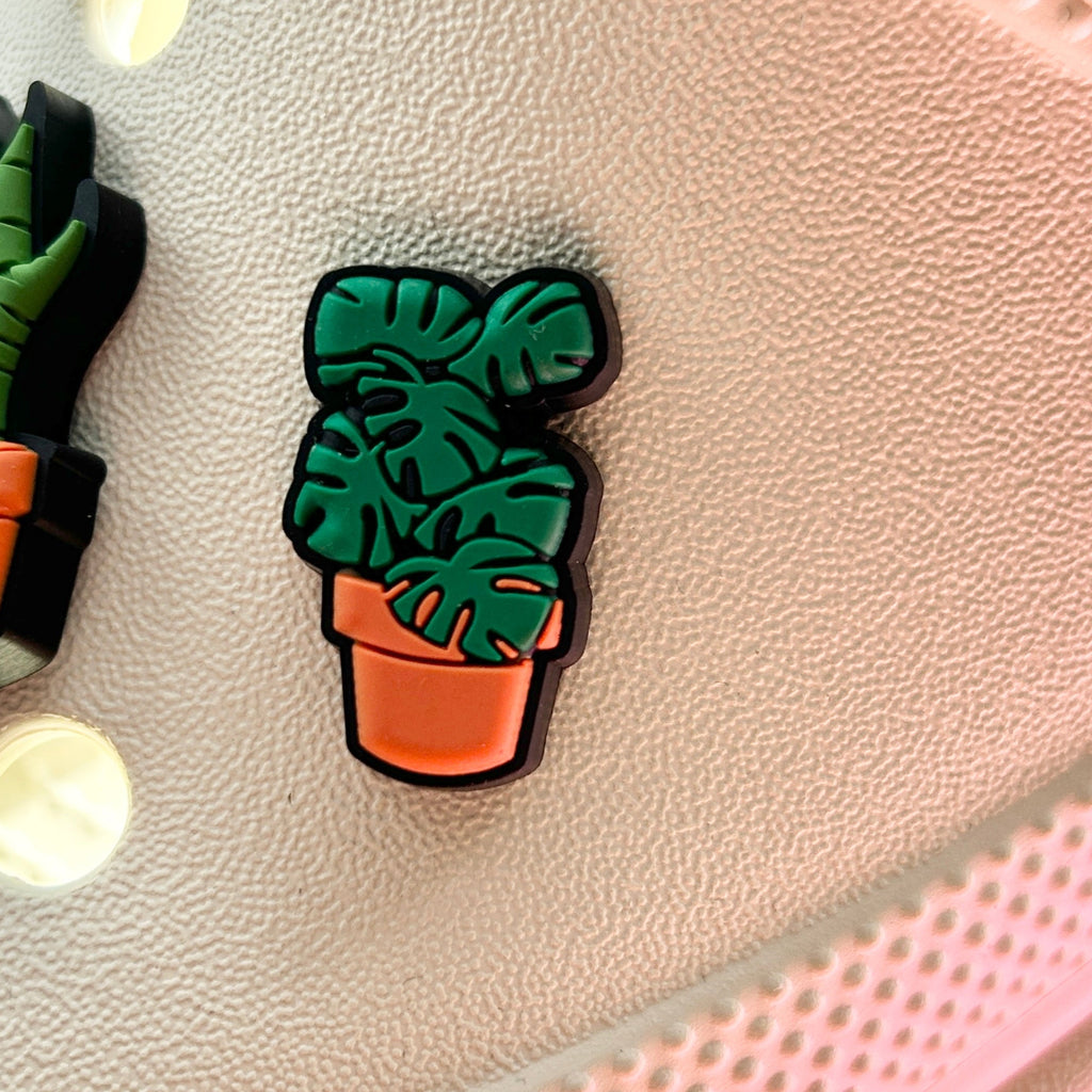 Monstera plant Croc shoe charm. Shown on a cream croc shoe. 
