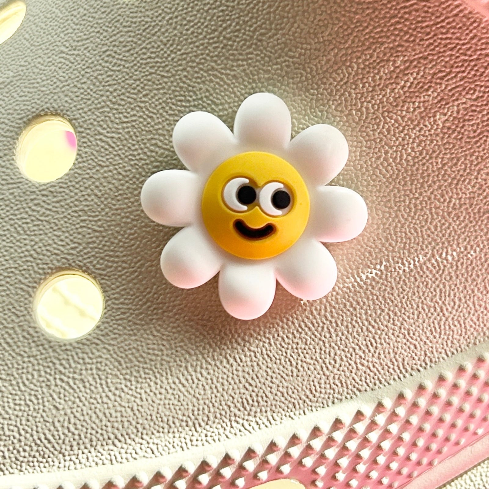 Smiley Daisy Flower croc shoe charm. Shown on a cream croc shoe.