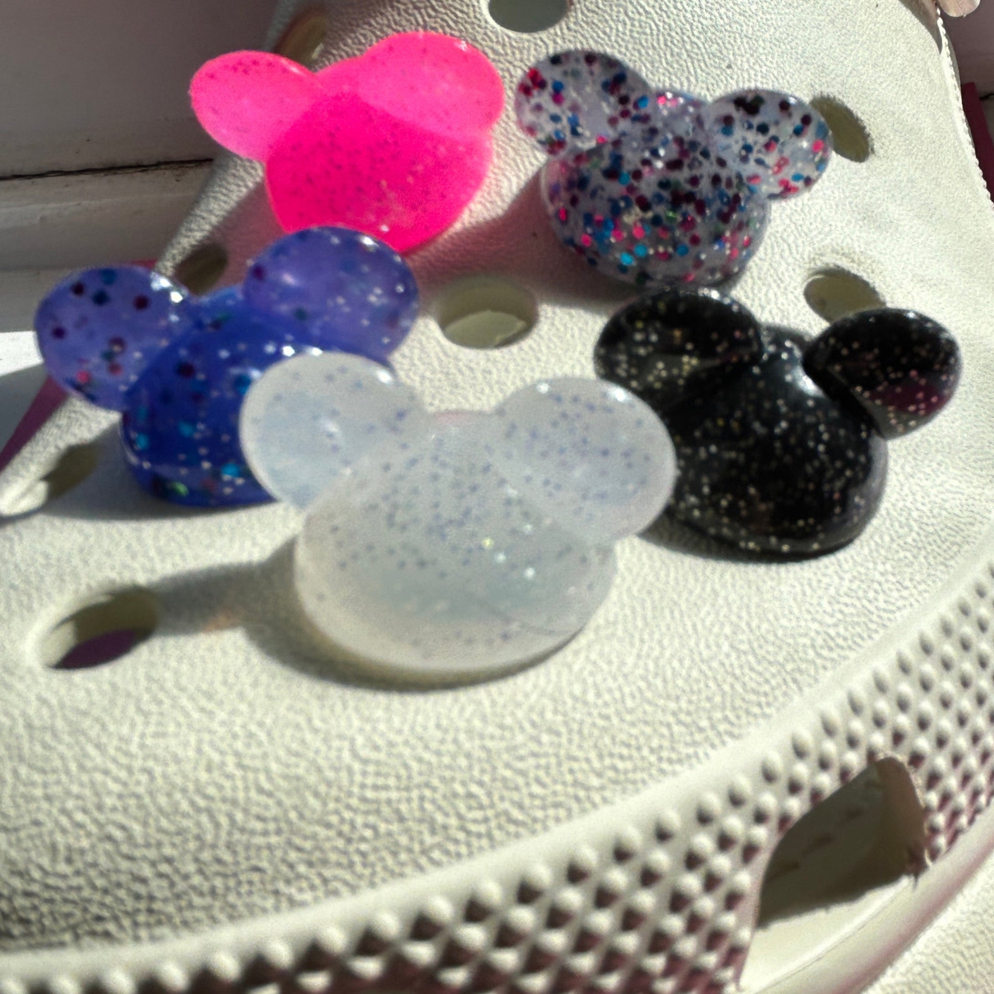 3D Glitter mouse ears modelled on a cream croc shoe. 
