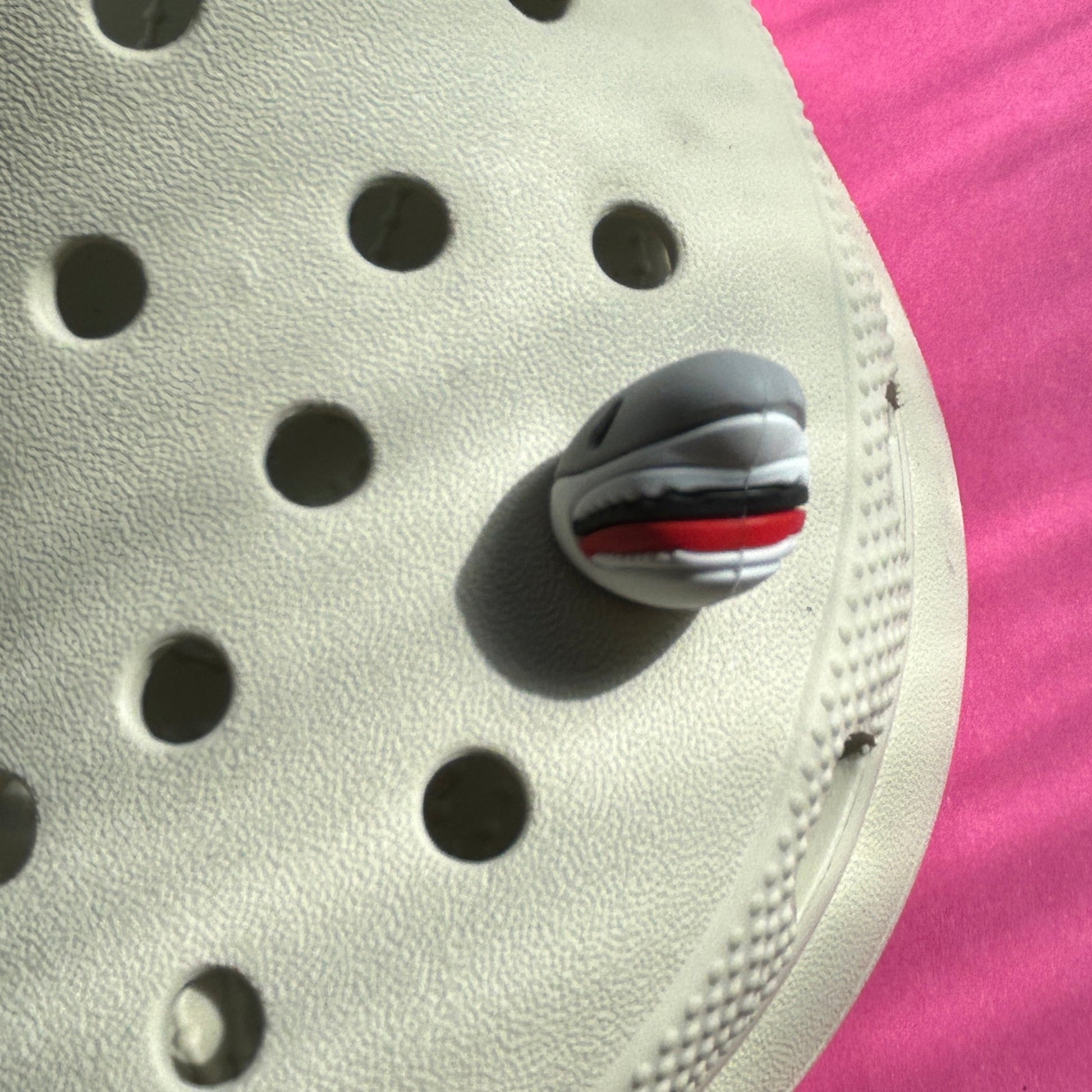 Great white shark 3D rubber croc charm. Modelled from the front on a cream croc shoe. 