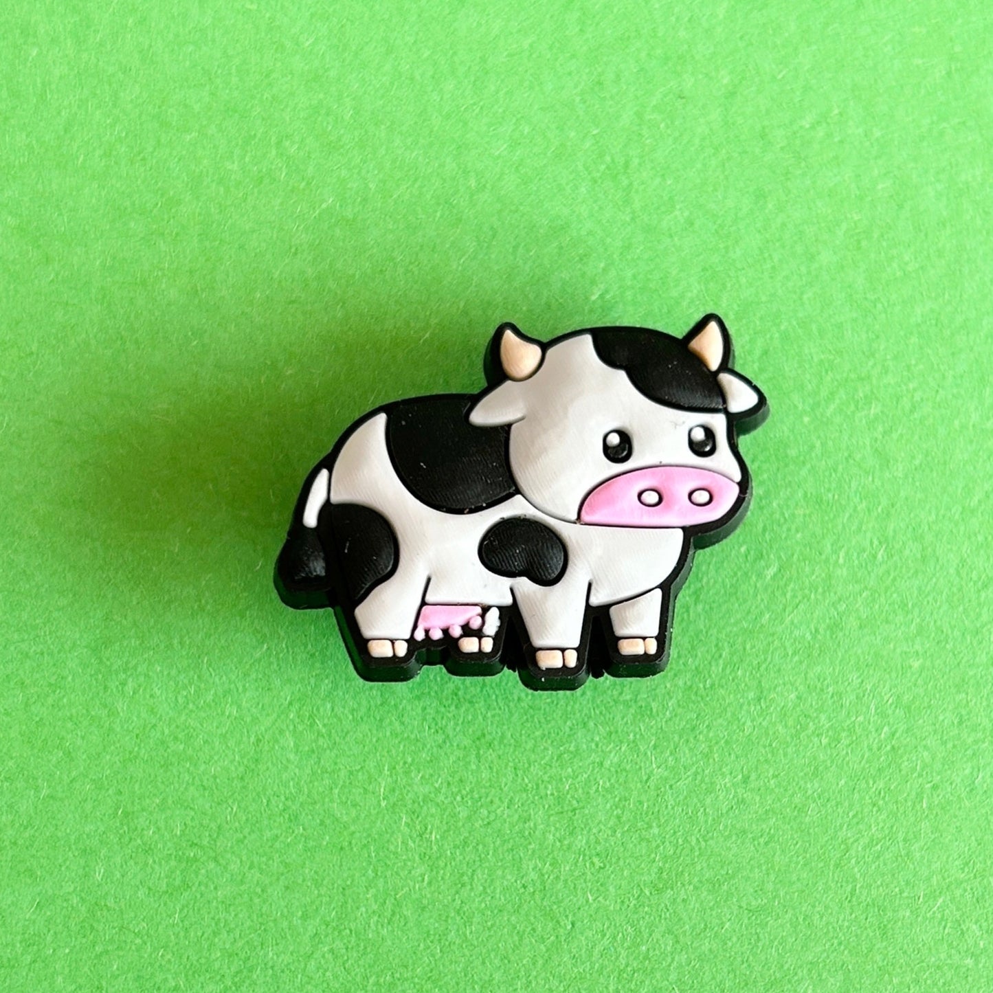 Black and white freesia cow croc shoe charm. 